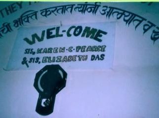 Welcome sign for sisters Das and Pearce